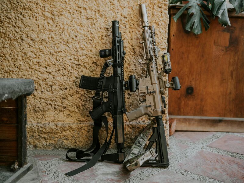 Two custom rifles with optics and accessories