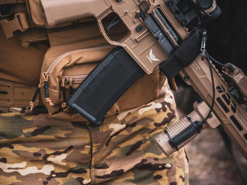 Tactical rifle detail with multicam gear